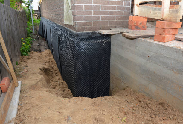 SJ Waterproofing Pros technician performing targeted Sump Pump Installation assessment in Duck River, TN